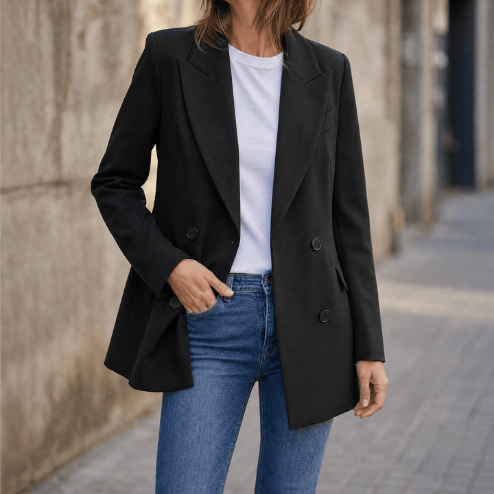 Black double breasted blazer worn over a white tee and jeans