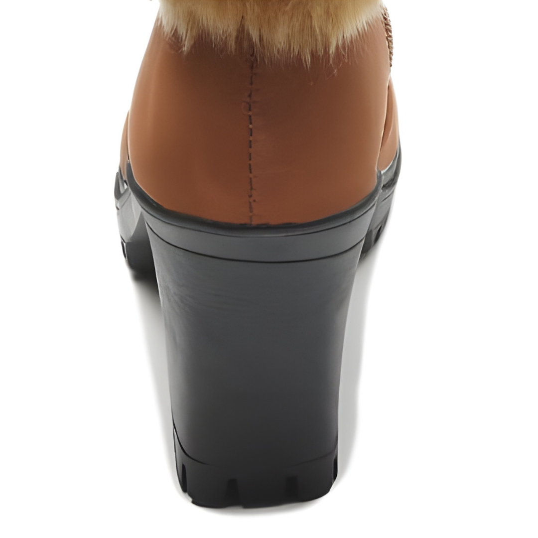 Chunky block heel detail on a tan faux fur cuff boot