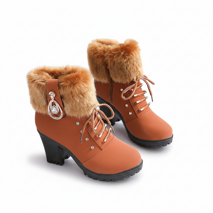 Tan winter boots with faux fur cuffs, block heels and a crystal charm
