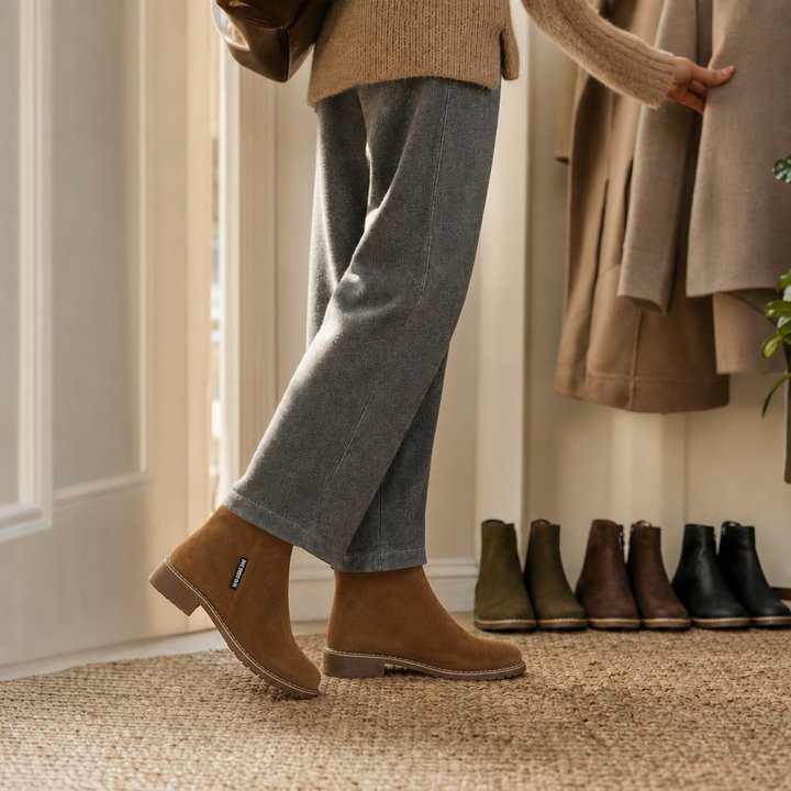 Tan suede ankle boots worn with grey jeans and a camel knit