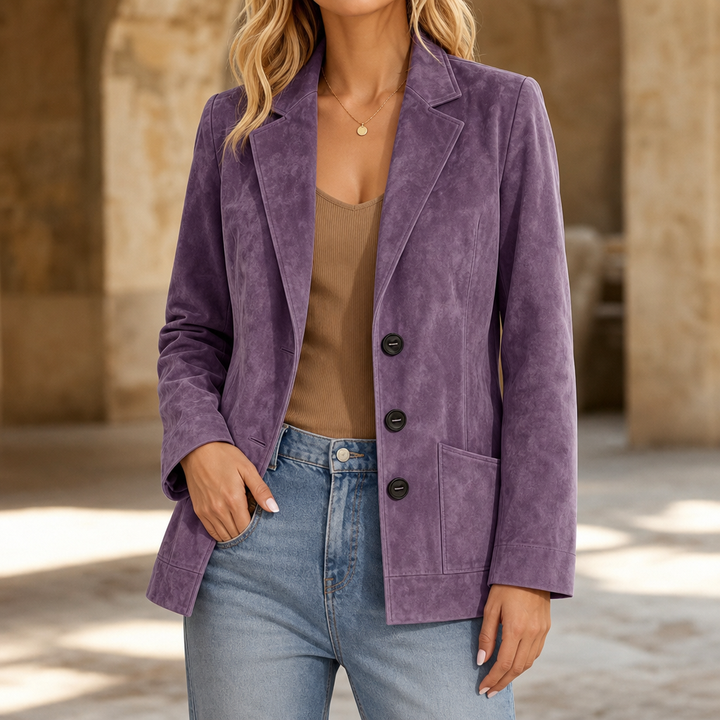 Purple faux suede blazer worn open over a tan top and jeans