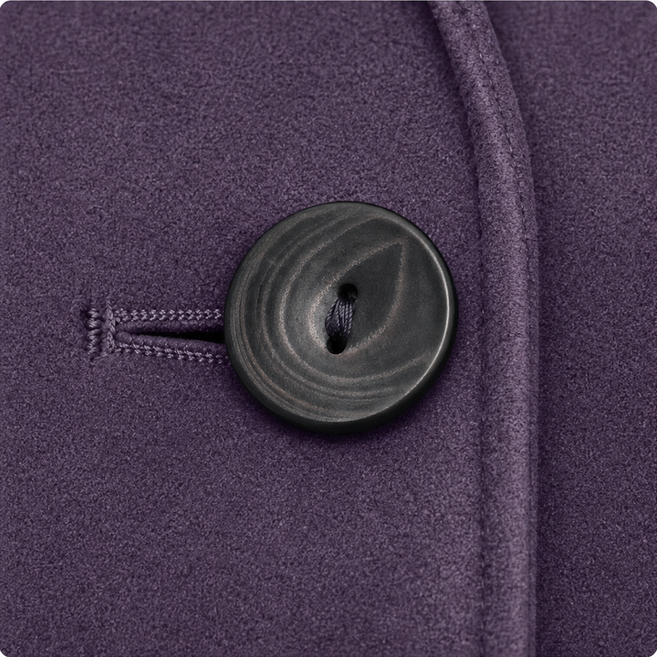 Dark horn button on a plum faux suede blazer