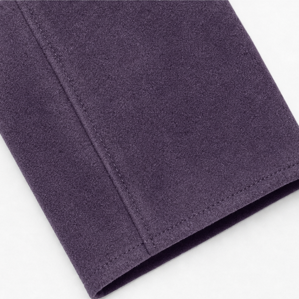 Topstitched cuff on a plum faux suede blazer sleeve