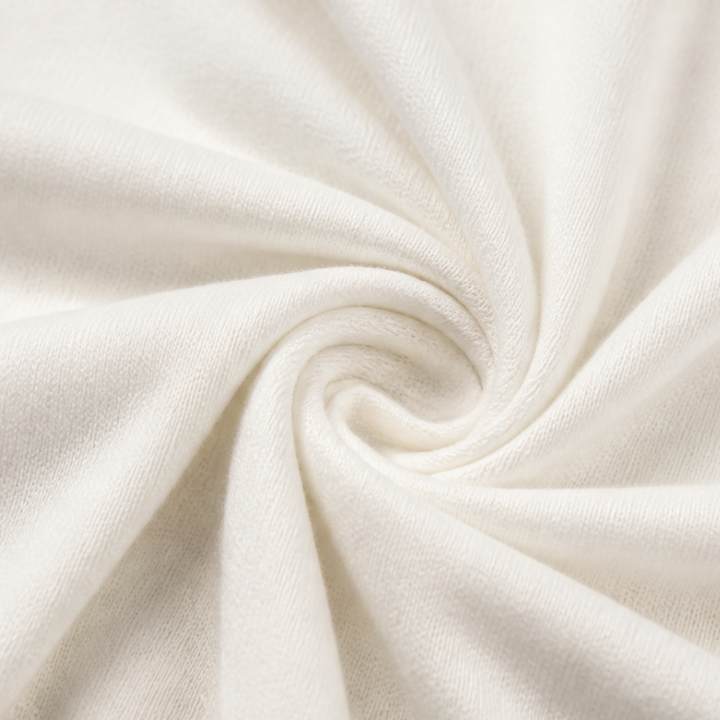 Close up of the soft ivory fine knit fabric