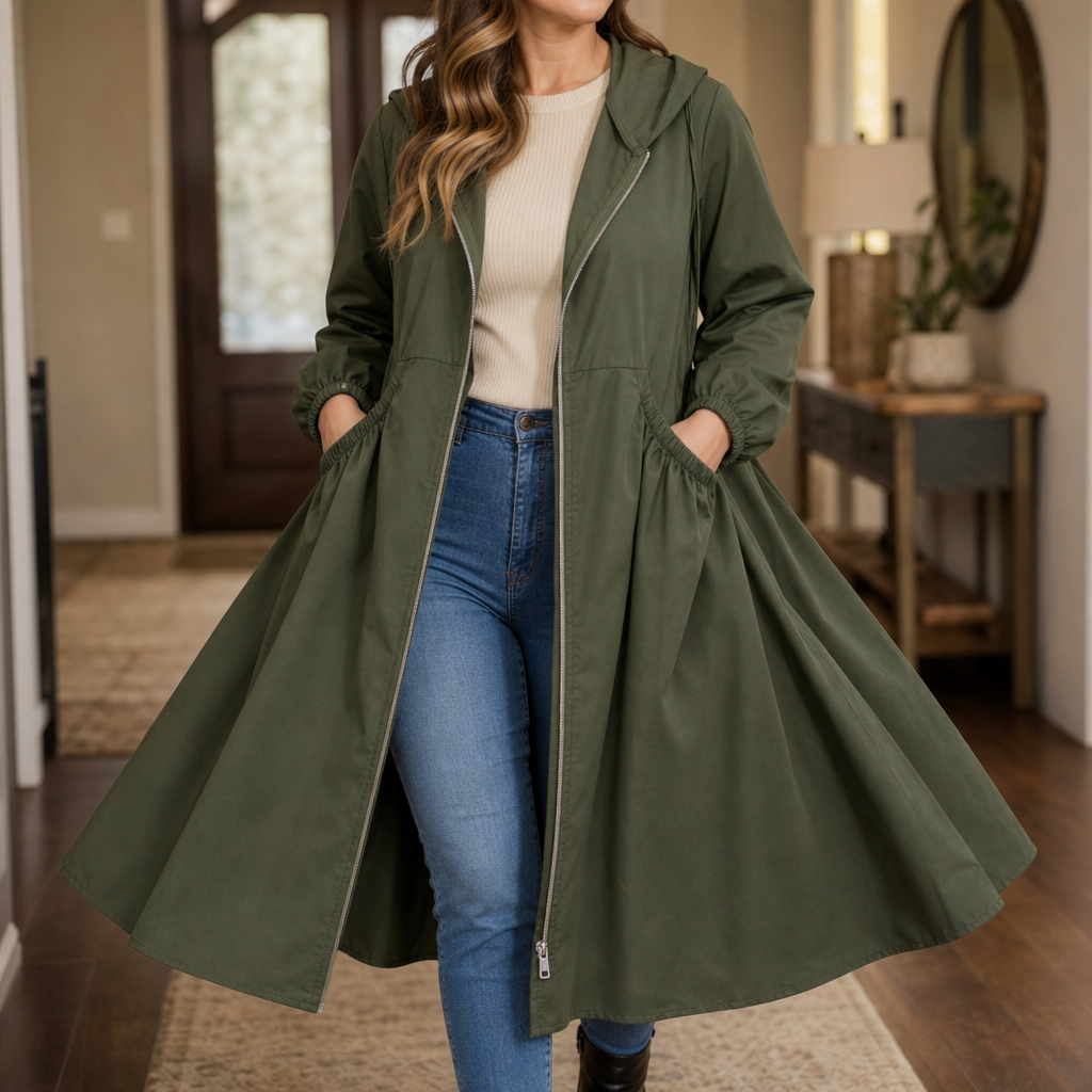 Olive peplum rain jacket worn open over a cream top and jeans
