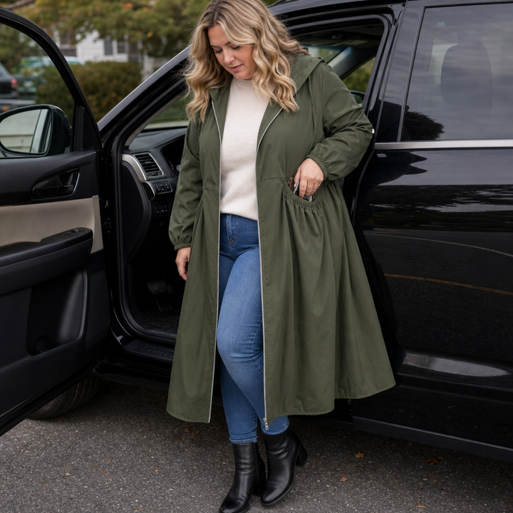 Woman stepping from a car in an olive peplum rain jacket
