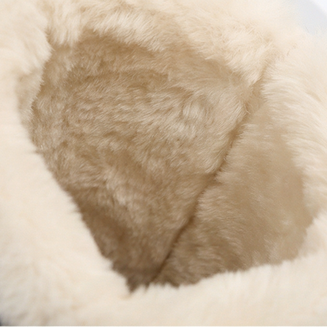 Cream plush fleece lining inside a black knee high boot