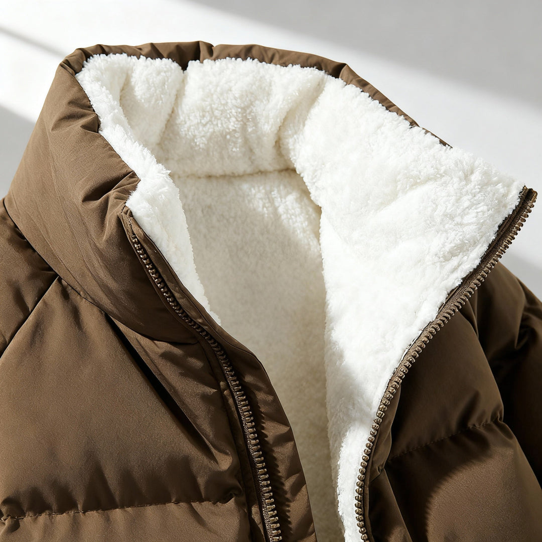 Open collar showing the cream sherpa lining of the puffer jacket