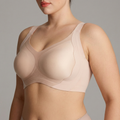 Blush wireless bra with framed full-coverage cups and wide straps, side view