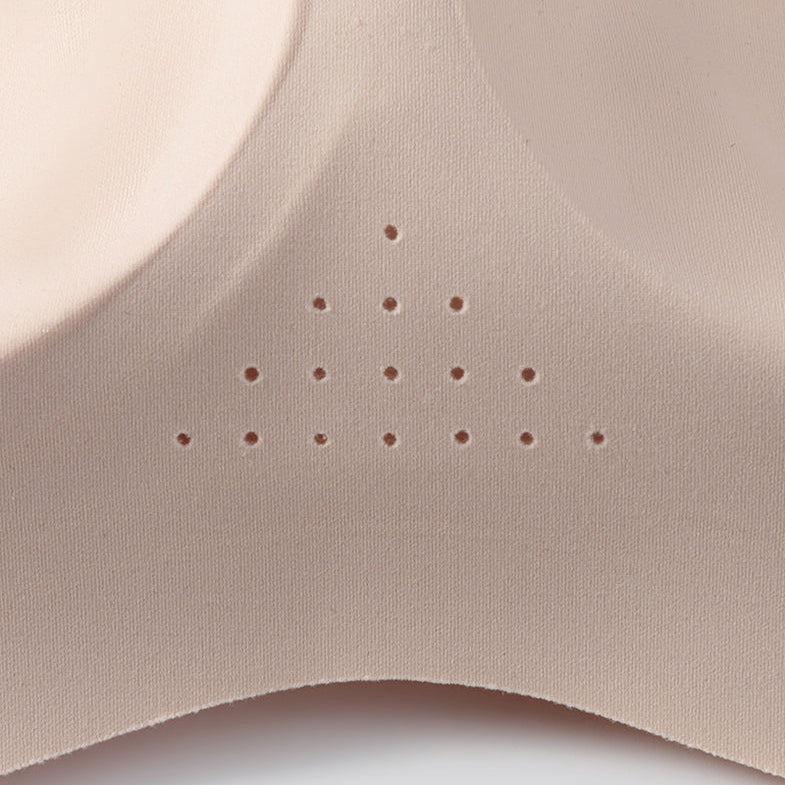 Close-up of the perforated centre panel on a nude bra