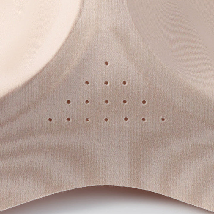 Close-up of the perforated centre panel on a nude bra