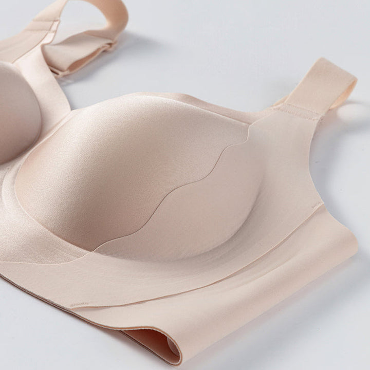 Nude framed cup wireless bra laid flat on white