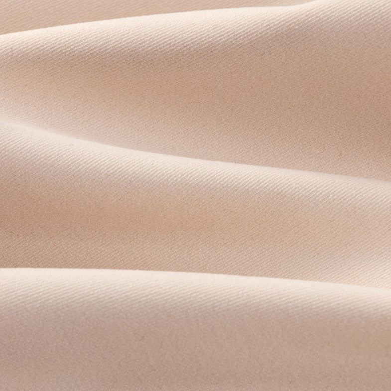 Close-up of the smooth nude bra fabric in soft folds
