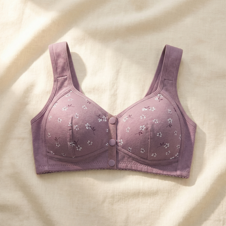 Lilac daisy print front-button bra laid flat on linen