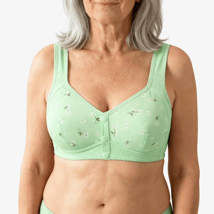 Mint green daisy print front-button bra worn on a body