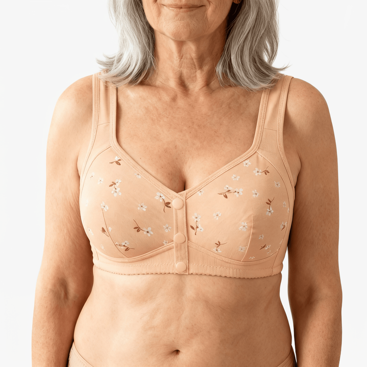 Nude daisy print front-button bra worn on a body