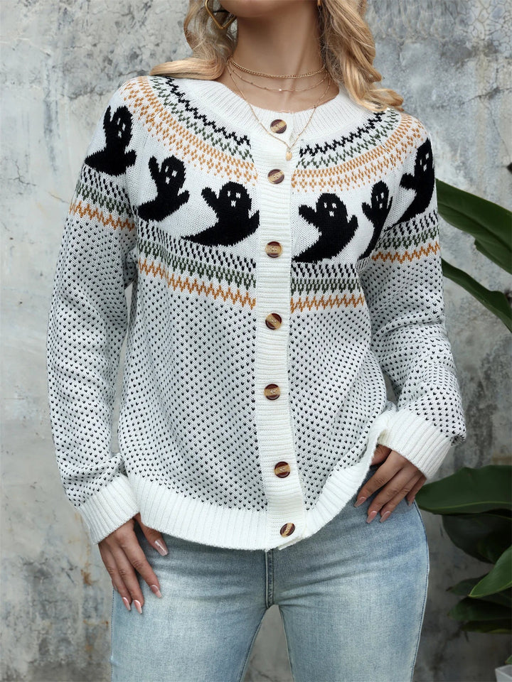 White knit cardigan with black ghost yoke pattern and wooden buttons, front view