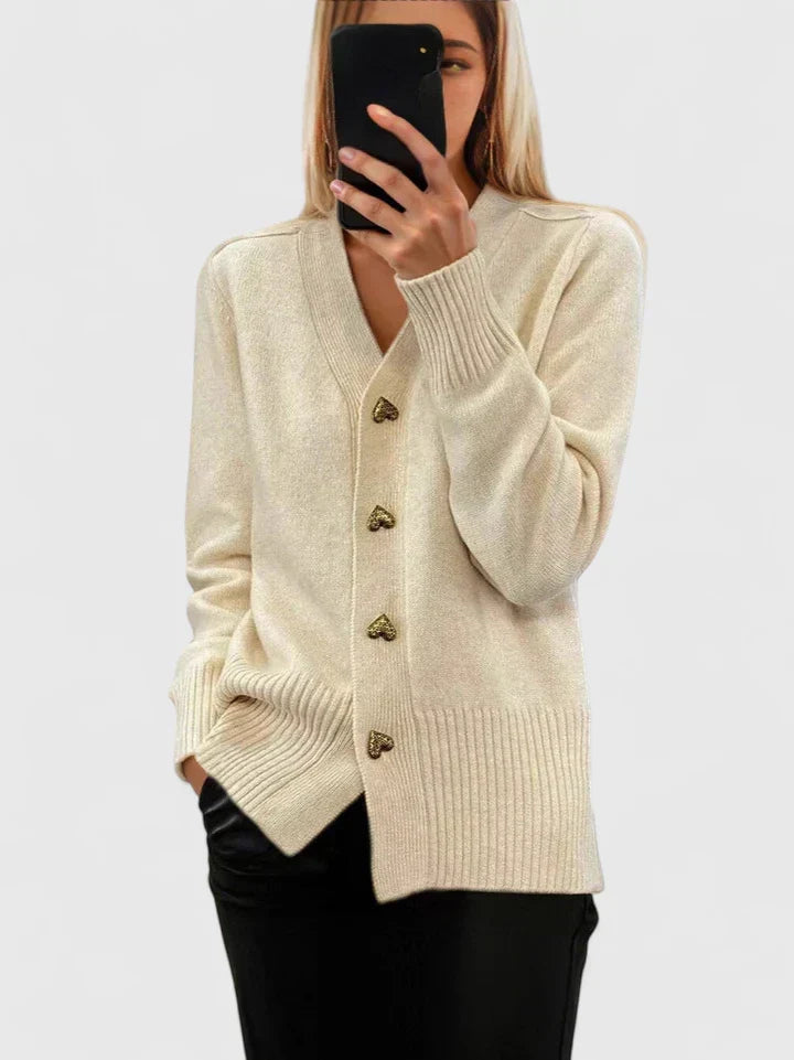 Cream knit cardigan with gold heart-shaped buttons
