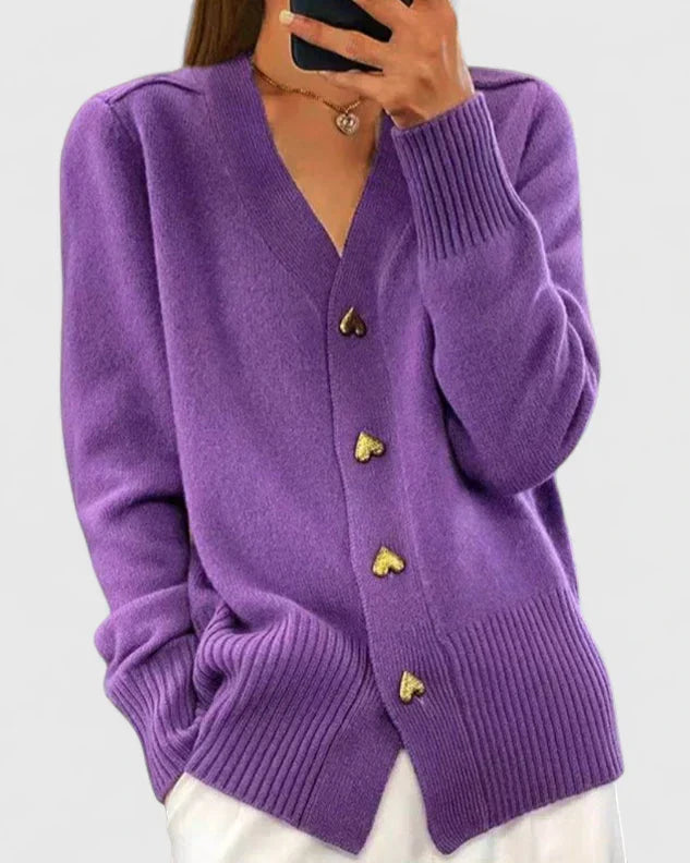 Purple knit cardigan with gold heart-shaped buttons