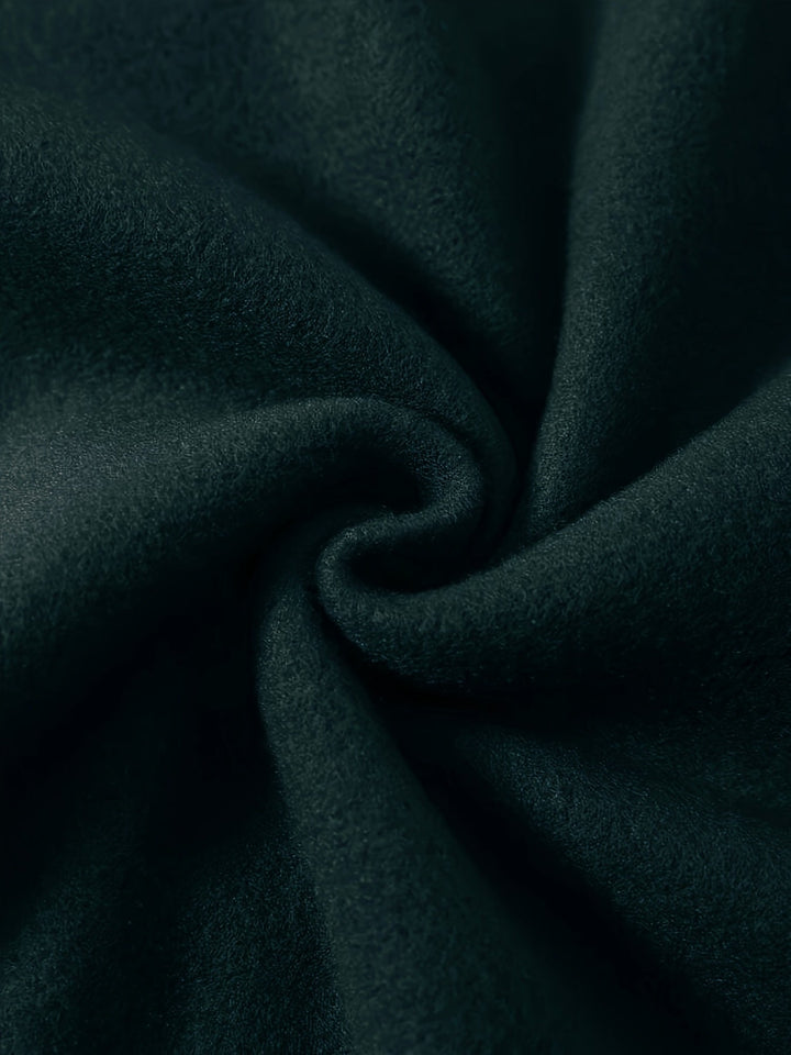Close up of the soft dark green brushed fleece fabric used for the sweatshirt