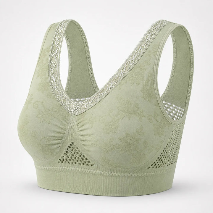 Sage green lace trimmed wireless bra with mesh side panels