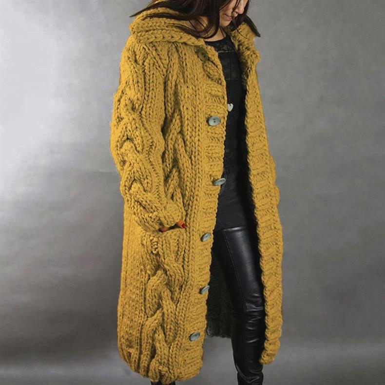 Mustard hooded cable knit longline coat over leather leggings