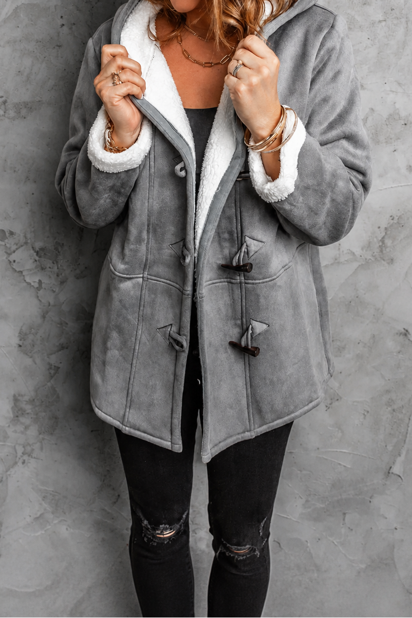 Grey faux suede hooded coat with a plush lining and toggles