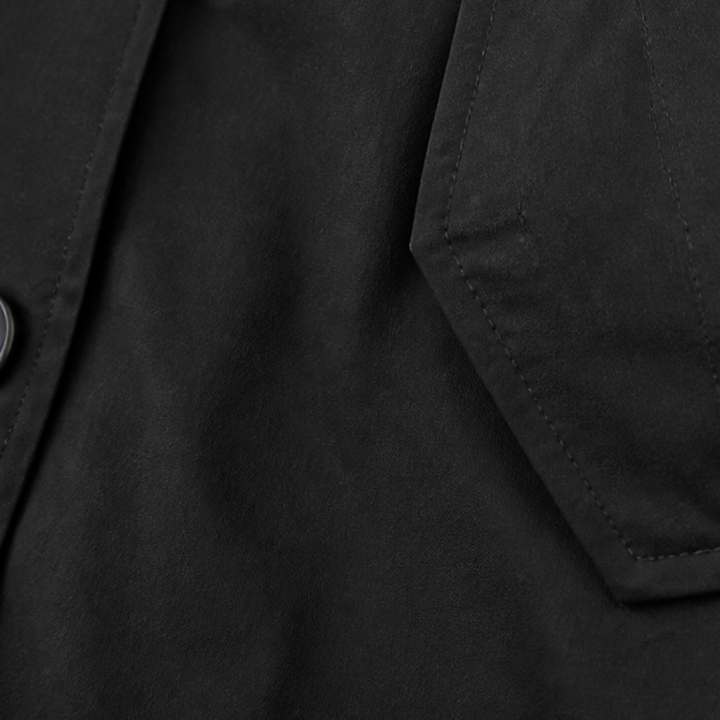 Set in sleeve seam on a black cotton hooded coat