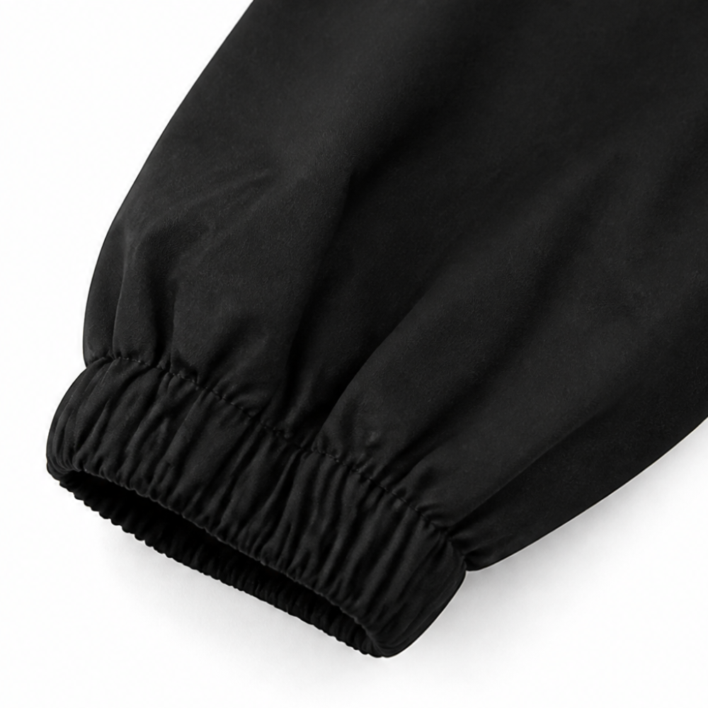 Elasticated cuff on a black hooded longline coat