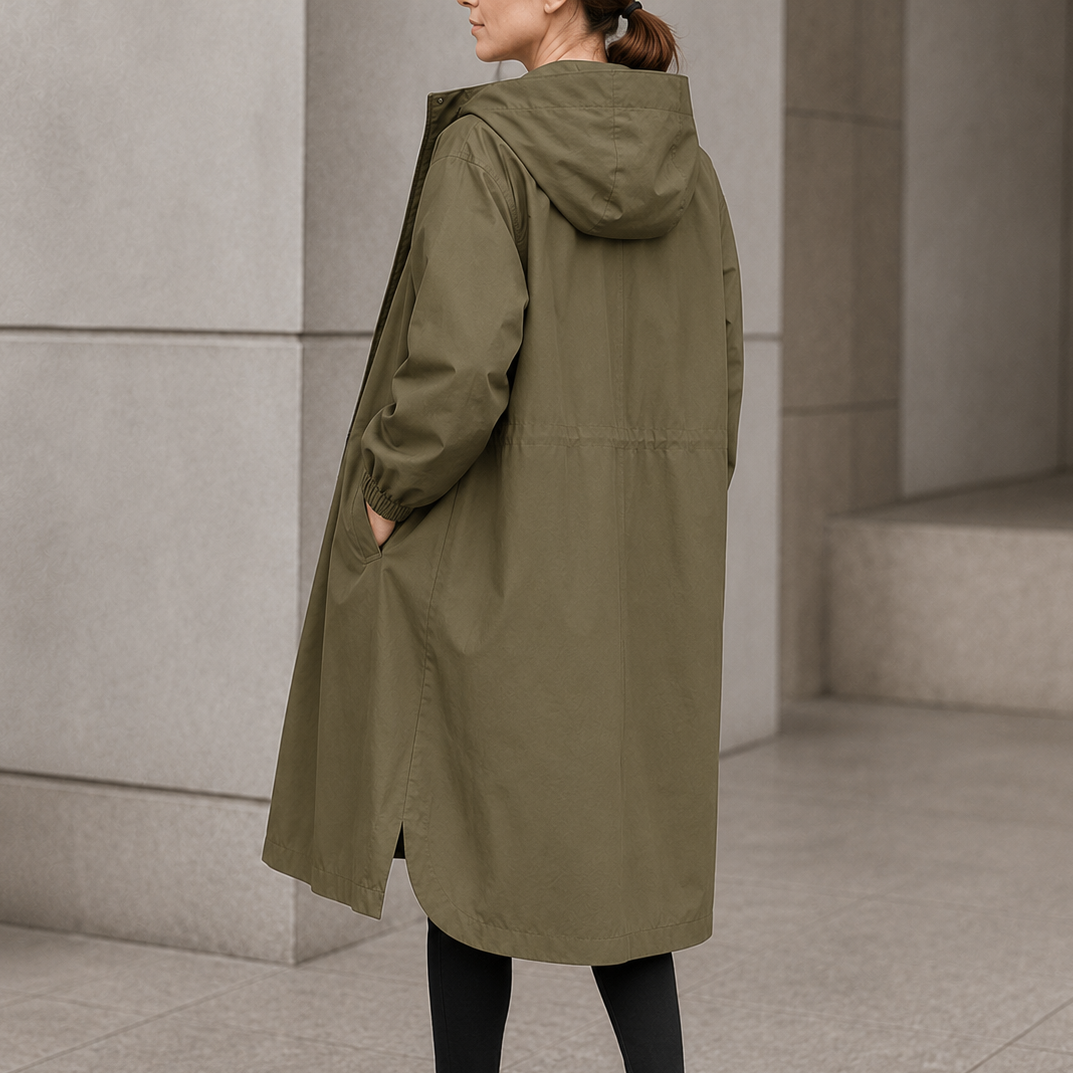 Olive hooded longline coat with a curved hem, back view
