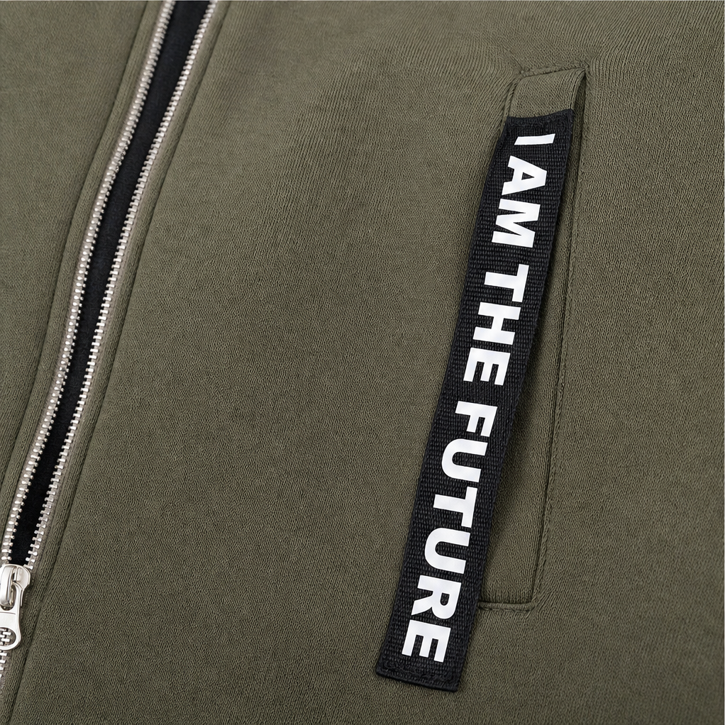 Zip and slogan tape welt pocket on an olive hooded coat