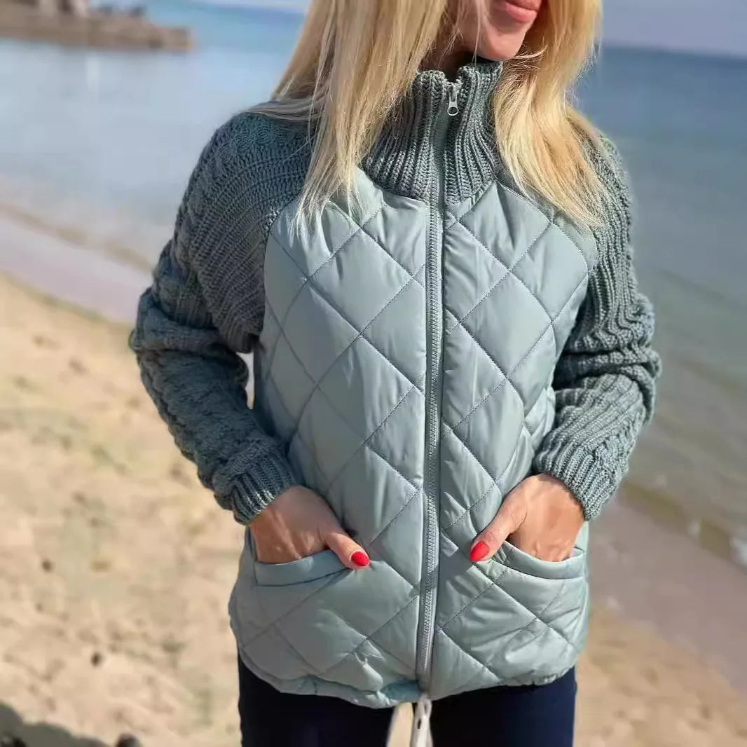Sage quilted jacket with knit sleeves and side pockets by the sea