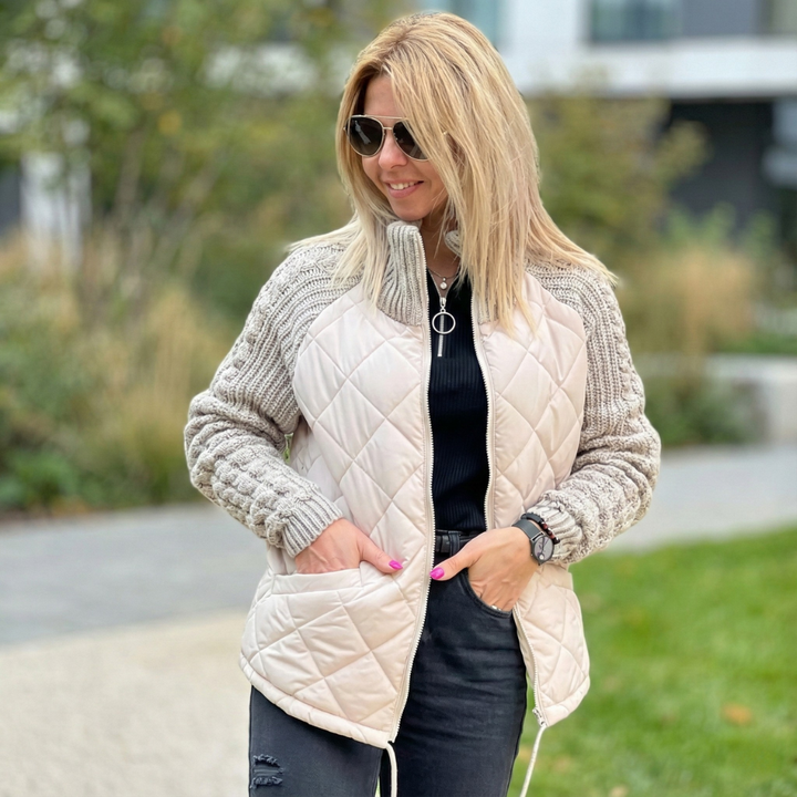 Cream quilted puffer jacket with chunky cable knit sleeves