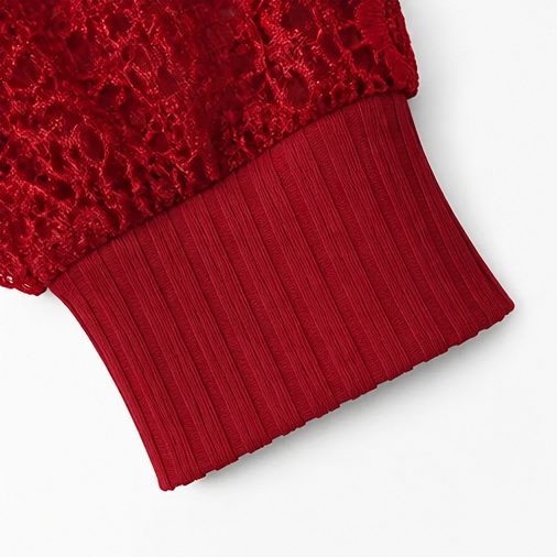 Close up of the red ribbed knit cuff and lace sleeve of a top