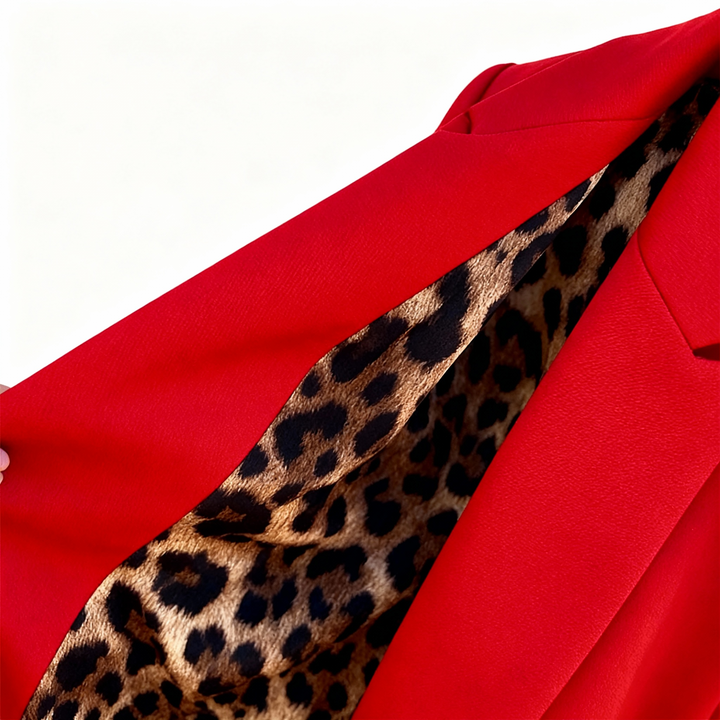Leopard print inner lining of a red tailored blazer