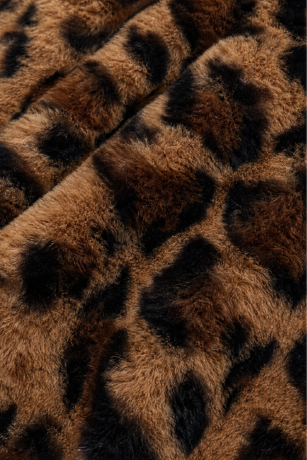 Close up of the soft leopard print faux fur pile