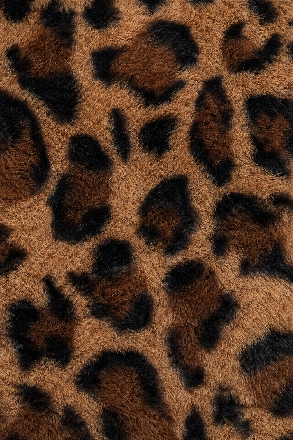 Close up of the leopard spot pattern on faux fur