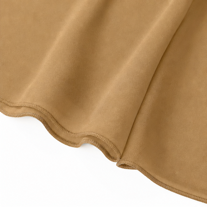 Rolled hem edge on draped camel chiffon fabric