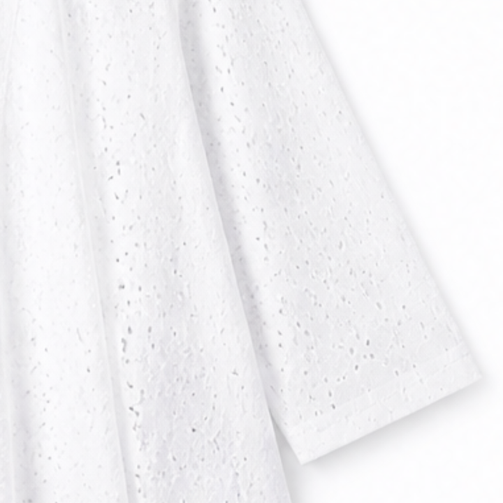 Draped white eyelet fabric on a lightweight open front cardigan