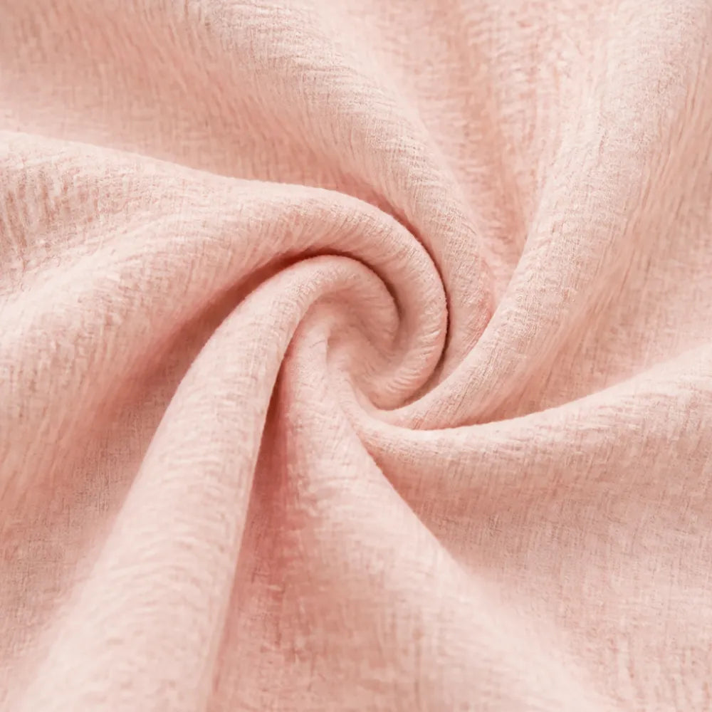Close up of the crinkled blush pink cotton fabric