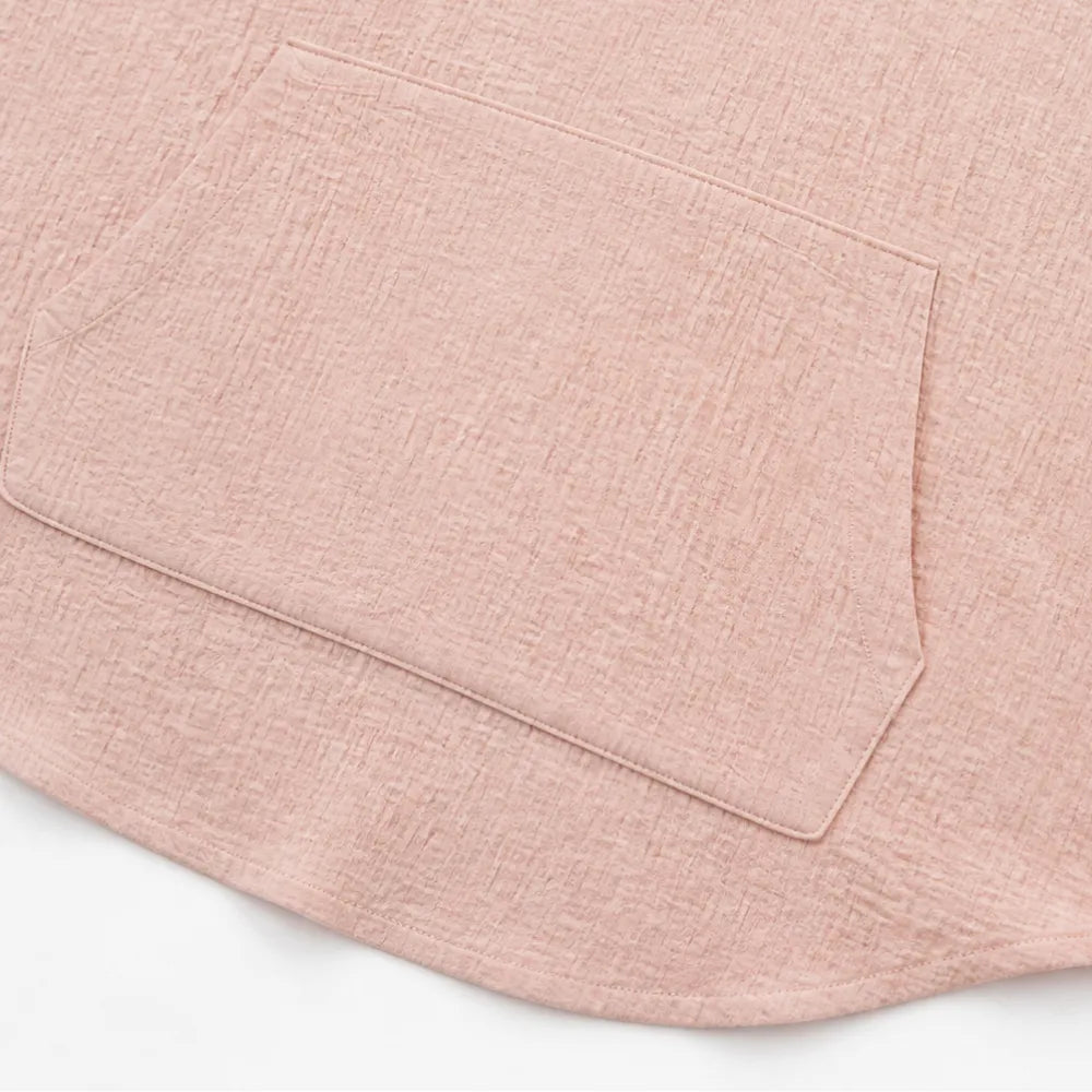 Kangaroo pocket and curved hem on a blush pink hooded top