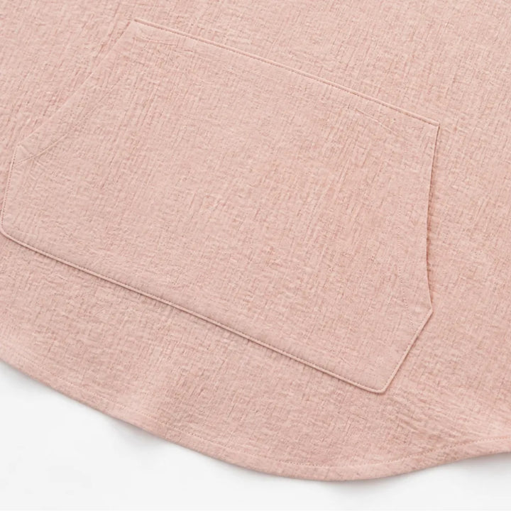 Kangaroo pocket and curved hem on a blush pink hooded top
