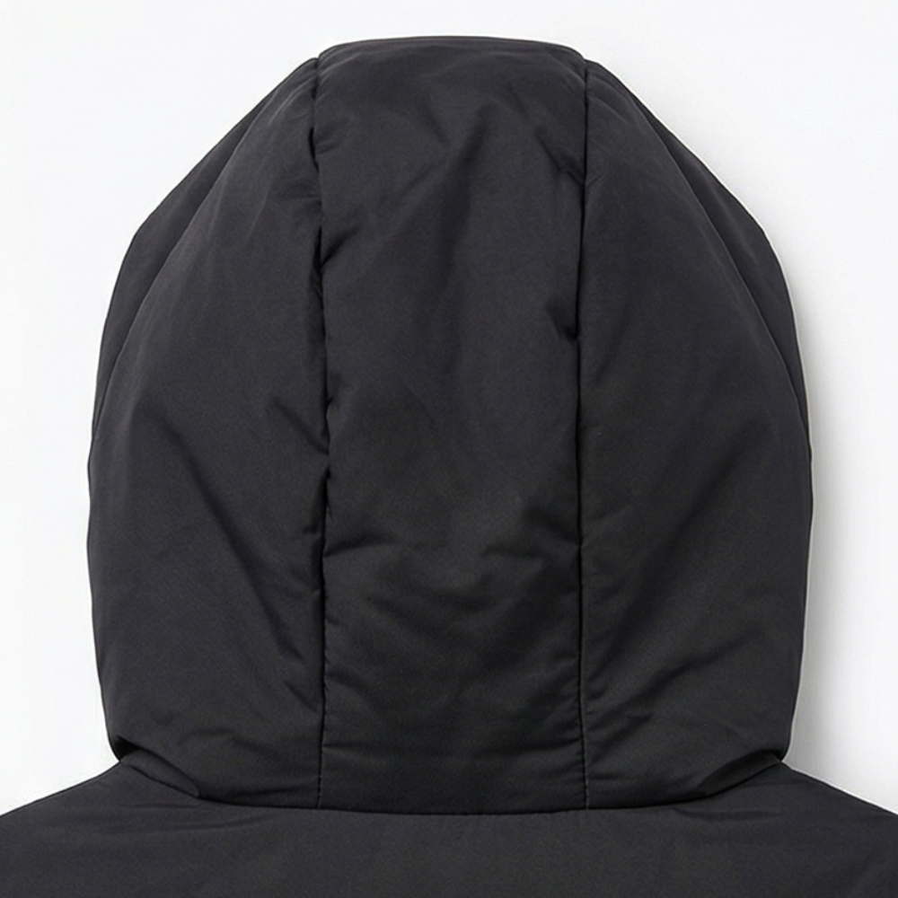 Close up of the padded hood on a black quilted puffer vest