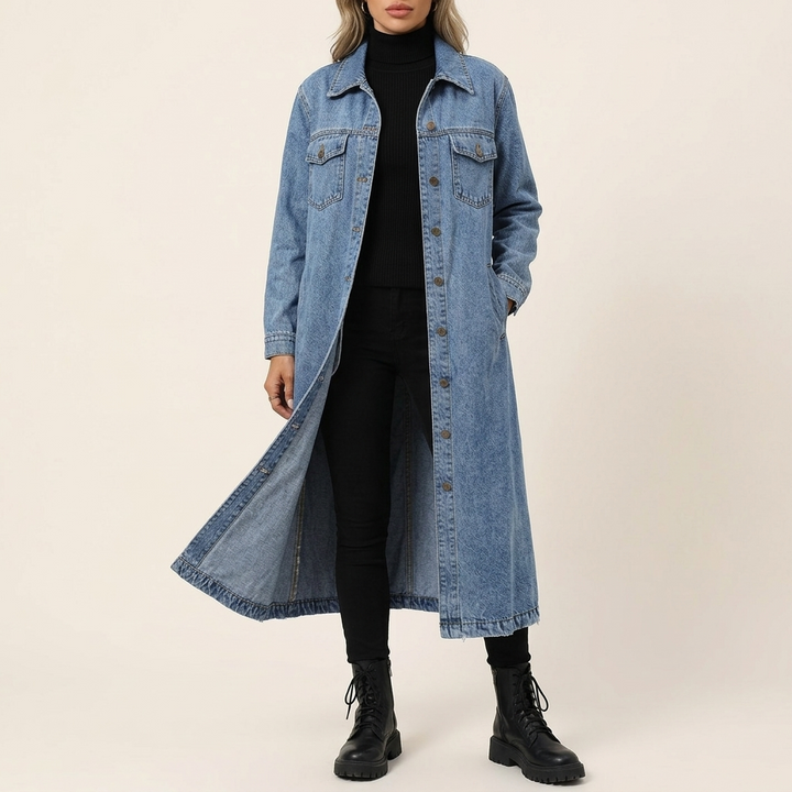 Light wash longline oversized denim coat worn with black jeans