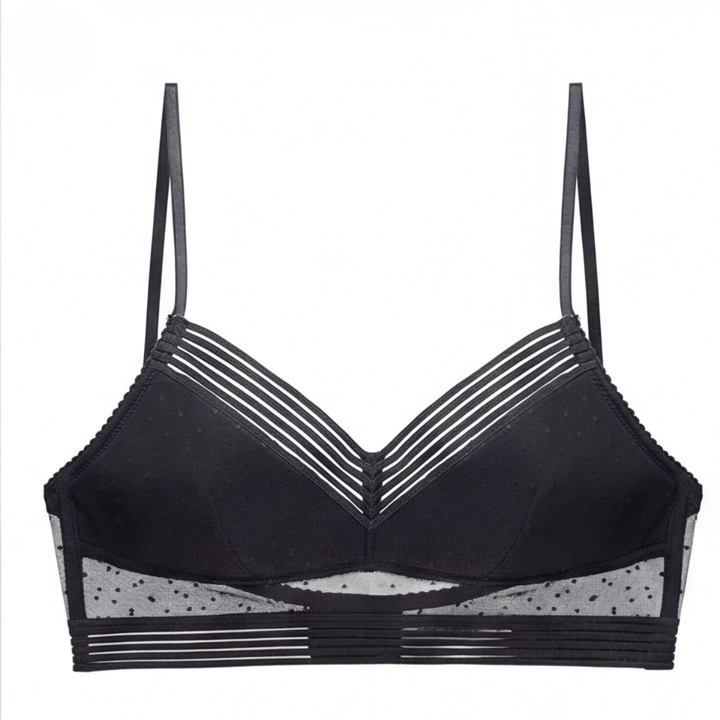Black dotted mesh bralette laid flat with thin straps