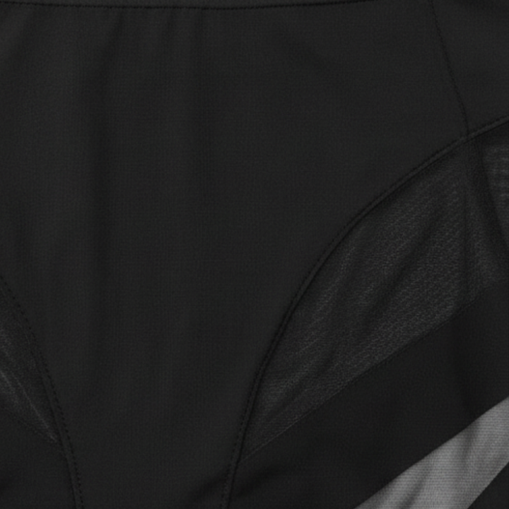 Close-up of the mesh panel seam on black briefs