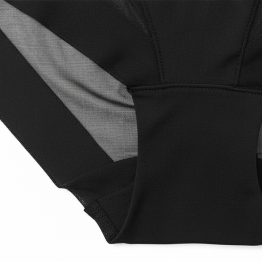 Black briefs folded to show the mesh panel and leg edge