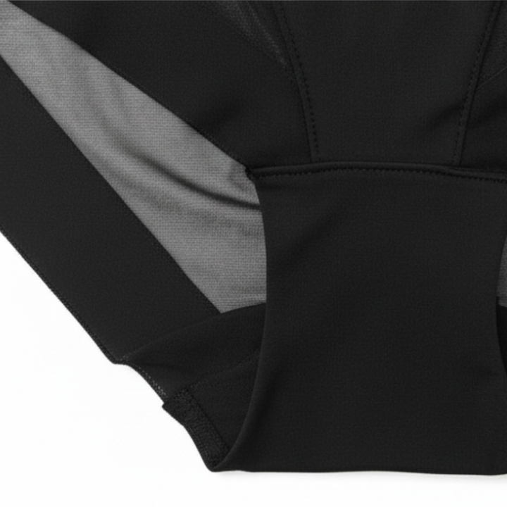 Black briefs folded to show the mesh panel and leg edge