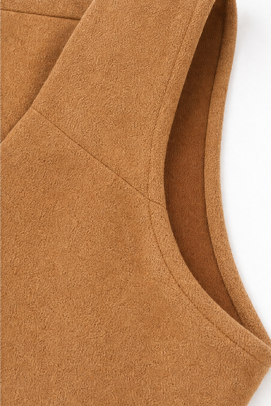 Armhole and side seam on a camel faux suede sleeveless vest