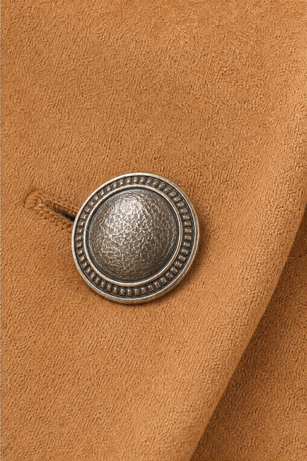 Antique silver button detail on a camel faux suede vest